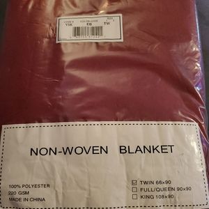 Non-woven twin blanket new in pkg